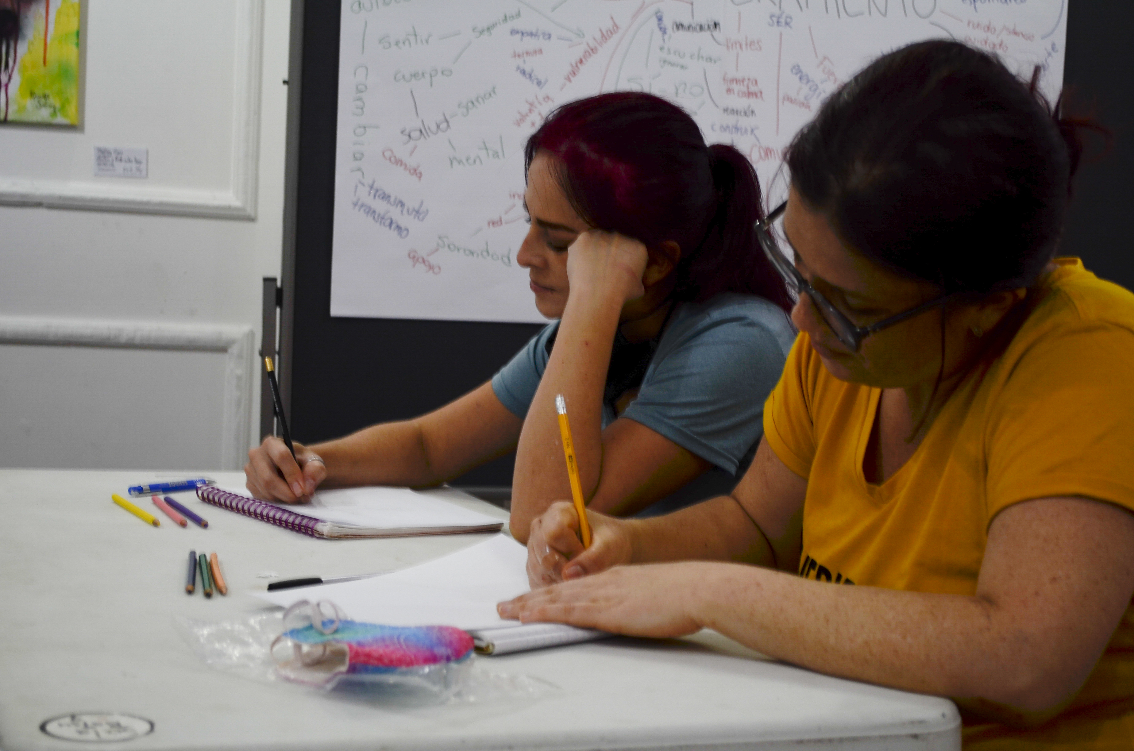 Writing workshop participants respond to prompts — Toby Israel facilitation